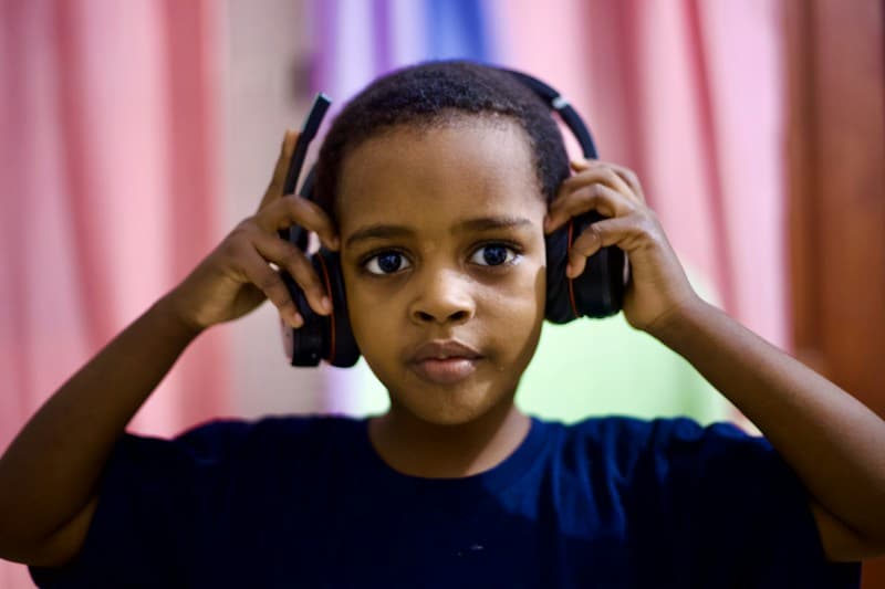 Student wearing headphones around her neck